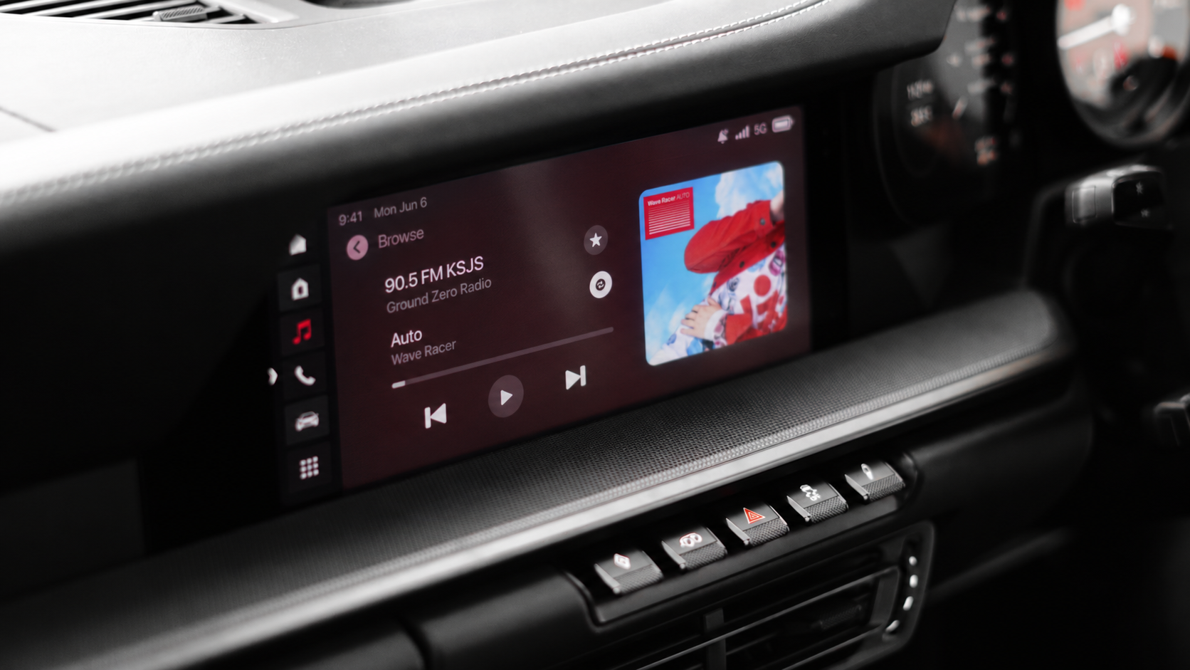 A car dashboard playing a podcast episode